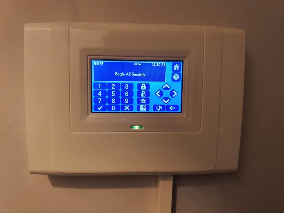 Modern touchscreen alarm panel for a wireless security system
