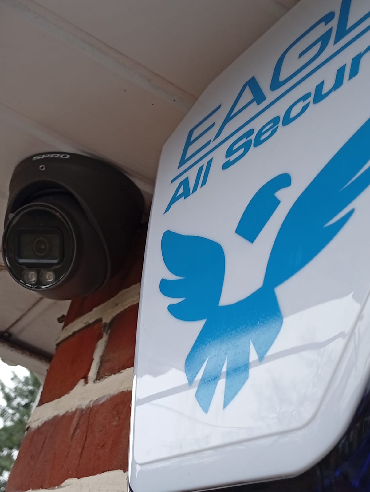 CCTV camera and alarm bell box installed on a London home for holiday security