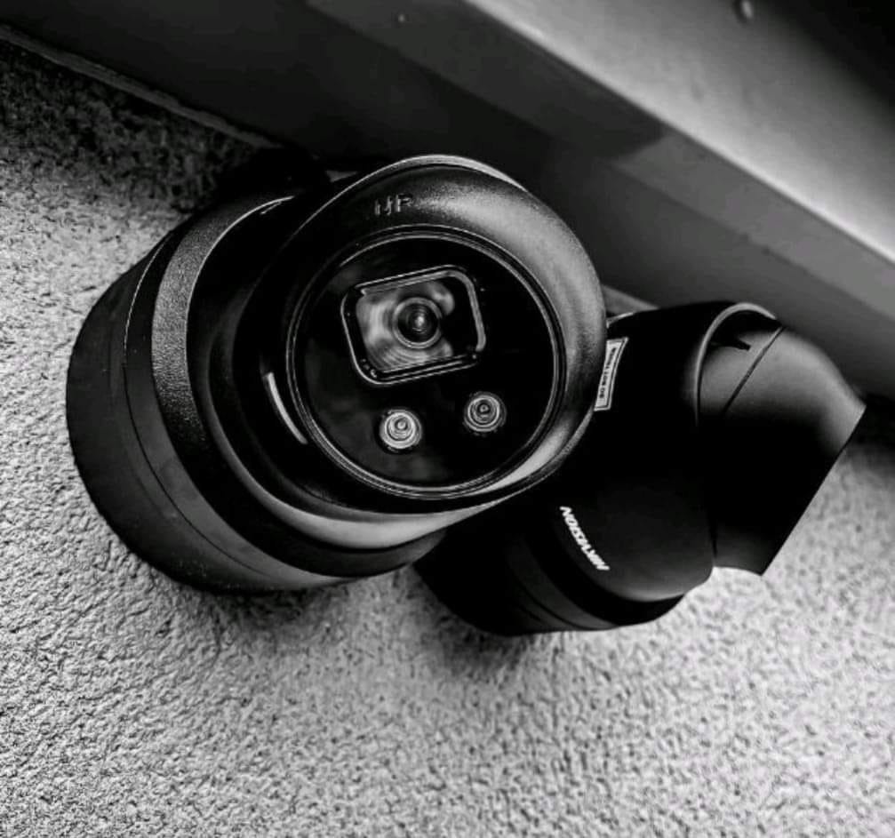 Professional CCTV dome camera installed under soffit for property surveillance