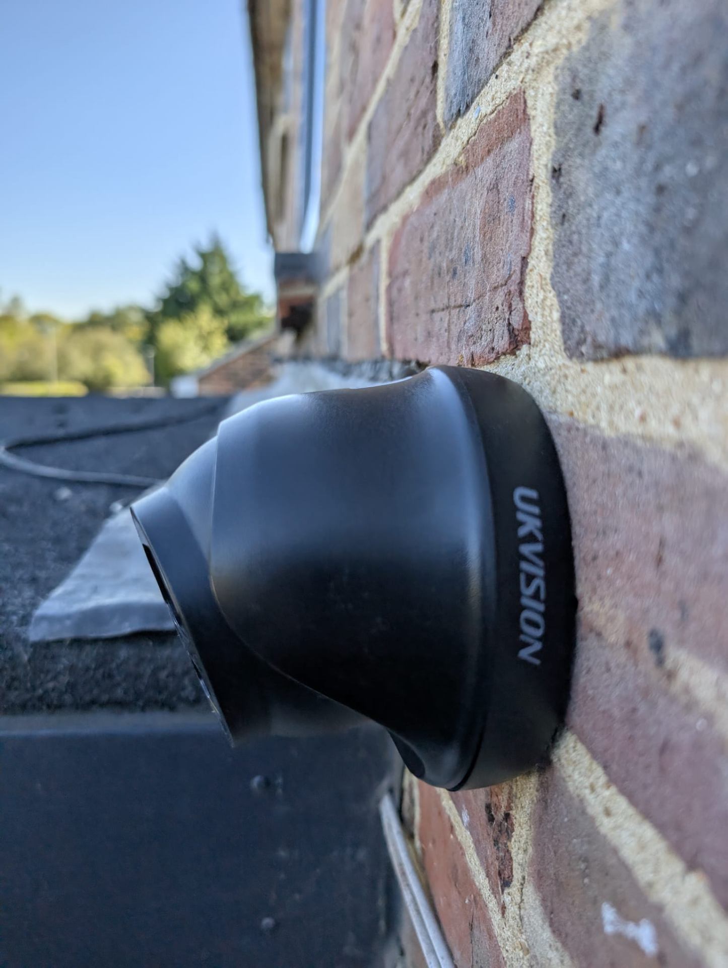 UKVision turret CCTV camera mounted on brick wall for driveway monitoring