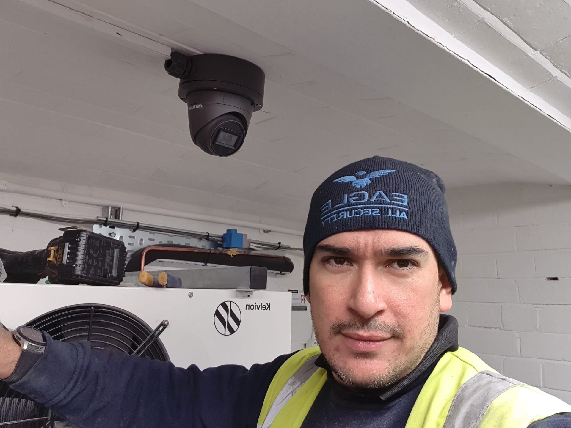 Eagle All Security engineer installing CCTV camera at a commercial property