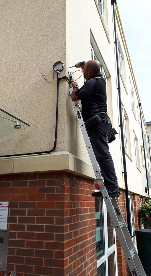 CCTV engineer replacing a security camera during a repair callout